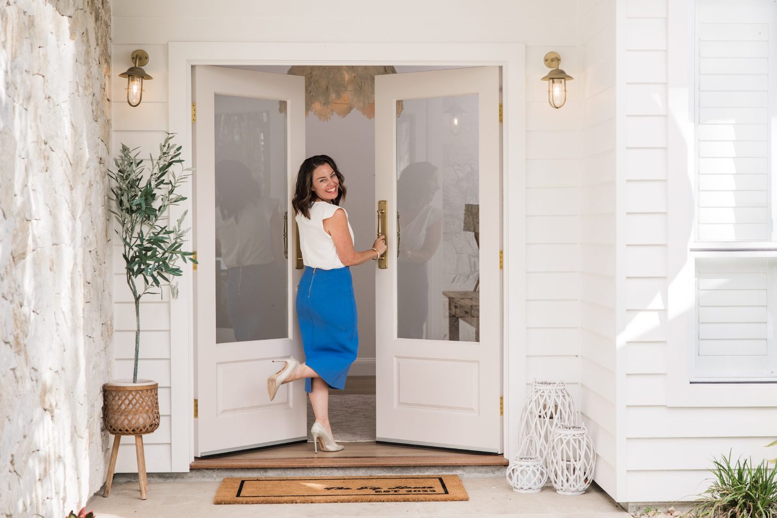 Tina Tower opening the door