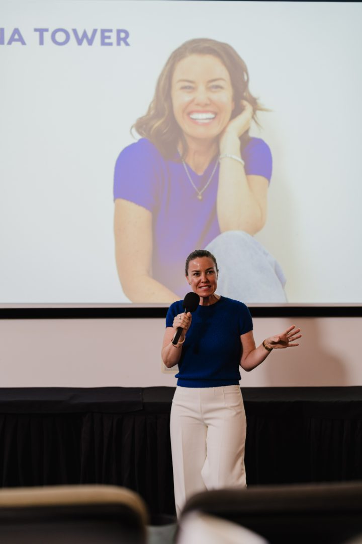 Tina Tower speaking on stage