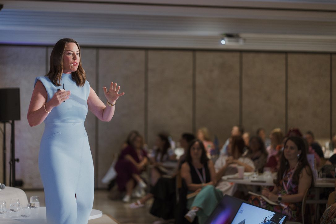 Tina Tower speaking on stage